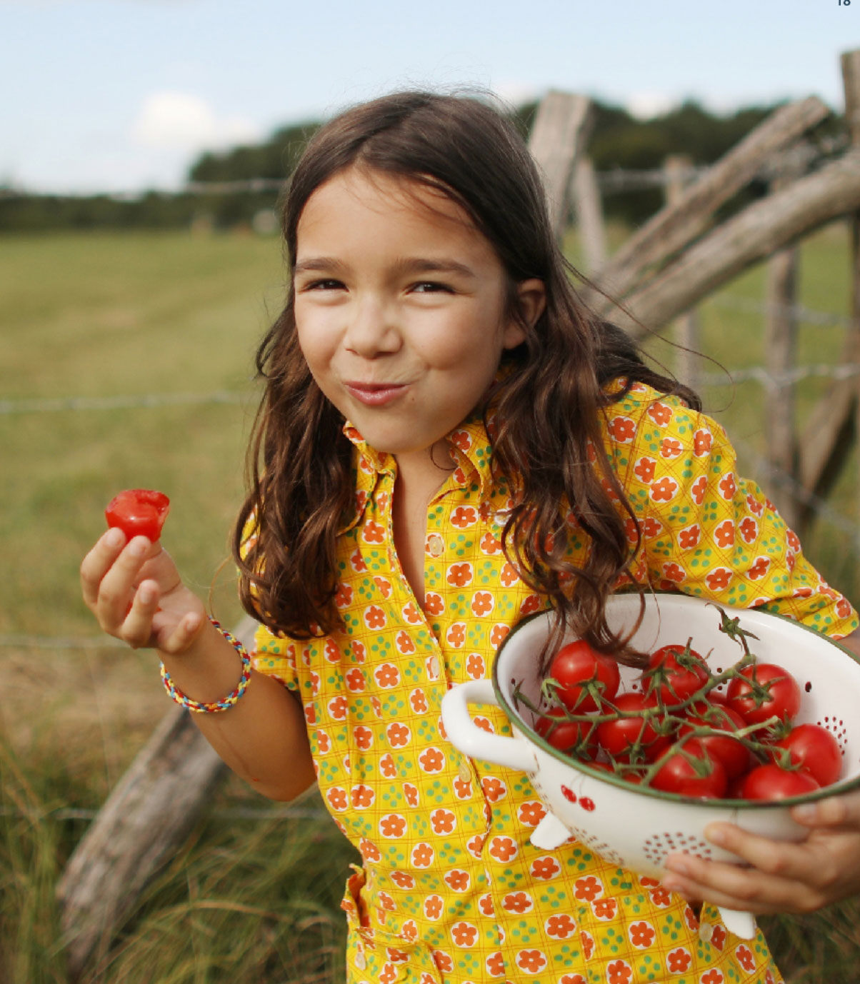 girl eating tomatoes